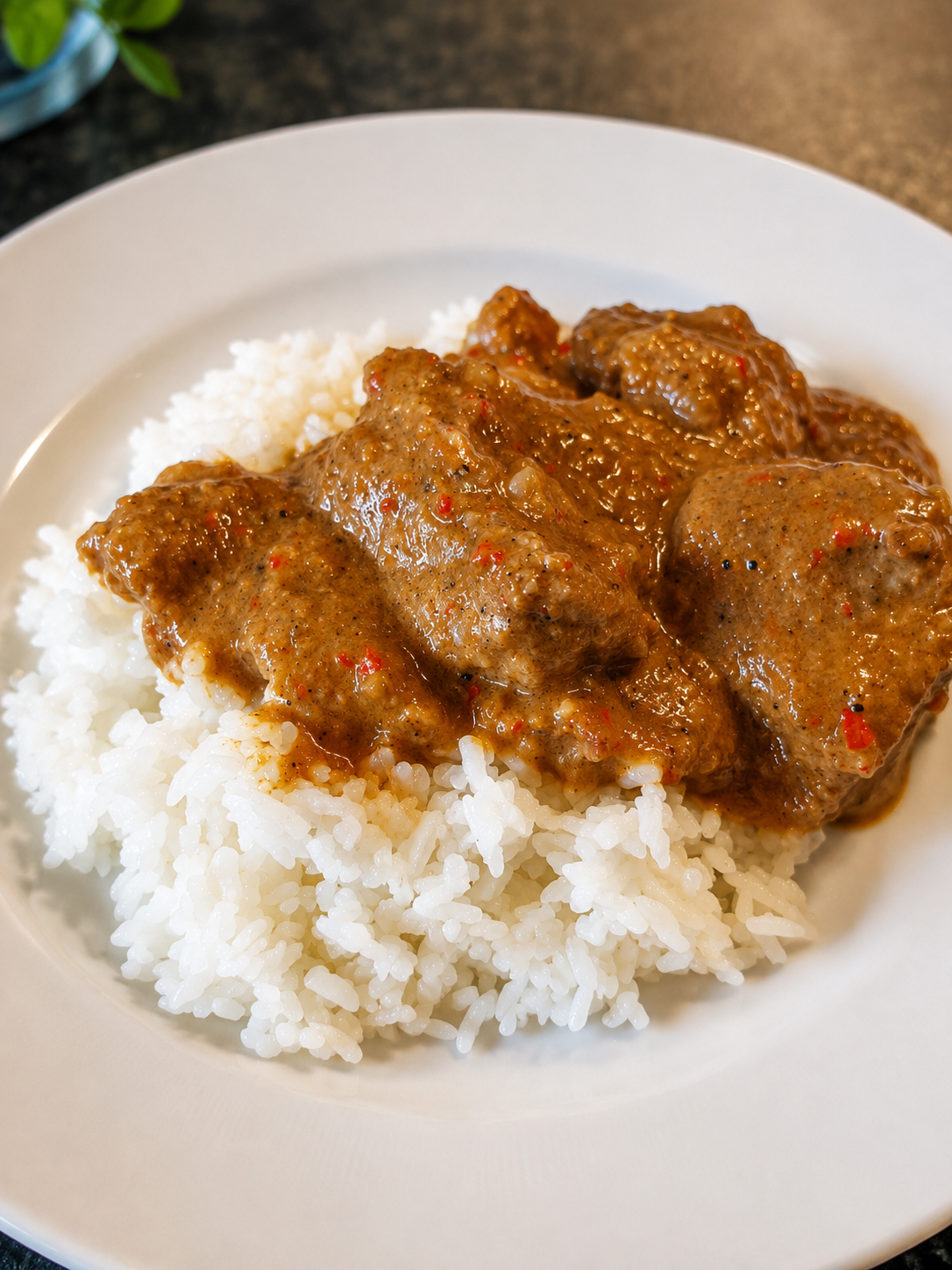 Plate of Protein Pantry beef rendang served over fluffy jasmine rice